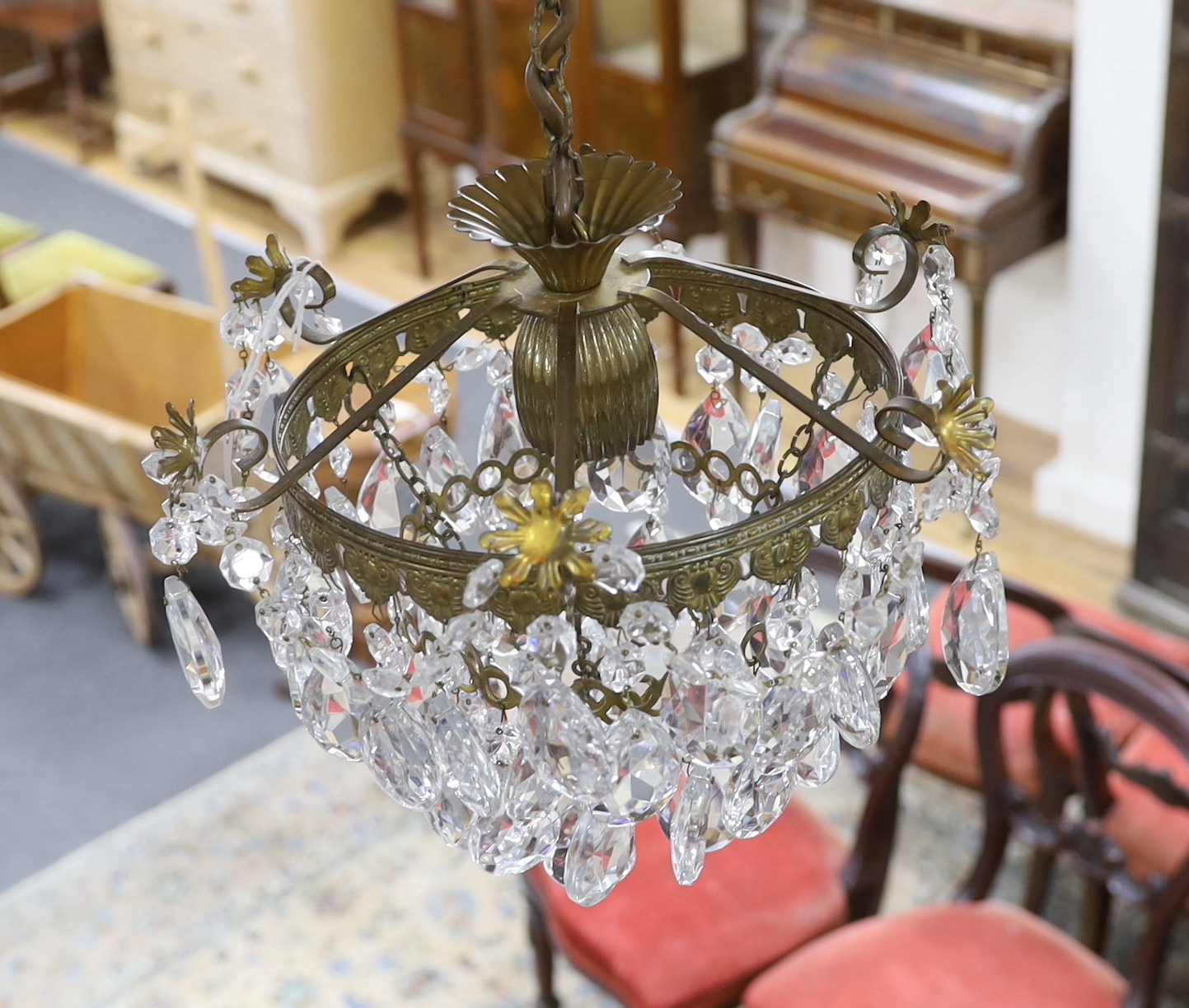 A gilt metal and cut glass ceiling shade hung faceted drops, height 42cm